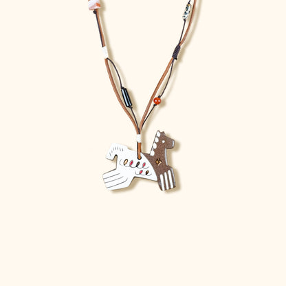 Her Market | Black Infinity Pattern Whimsical 8-Leg Pony Necklace