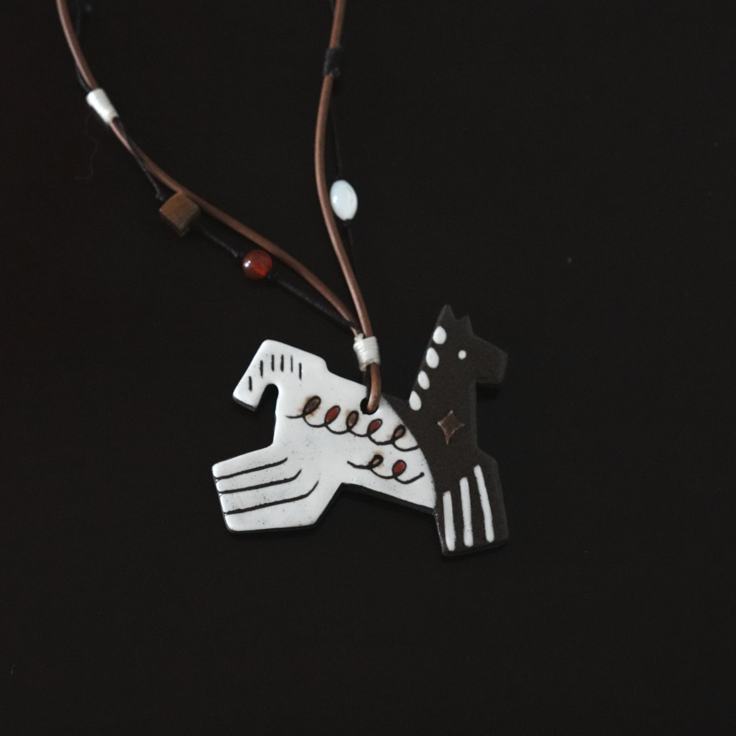 Her Market | Black Infinity Pattern Whimsical 8-Leg Pony Necklace