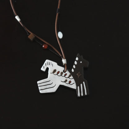 Her Market | Black Infinity Pattern Whimsical 8-Leg Pony Necklace